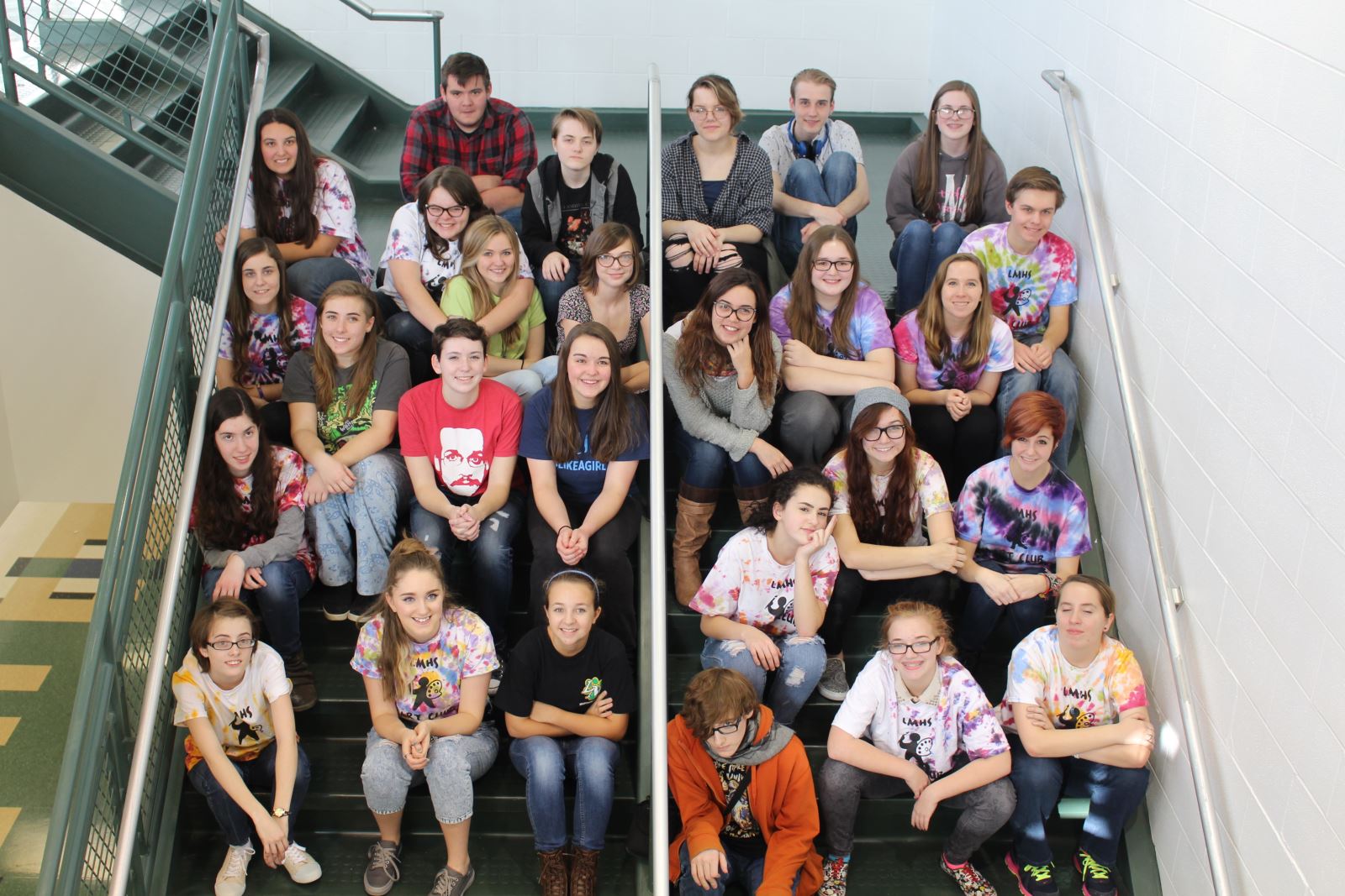 high school students sitting on stairs